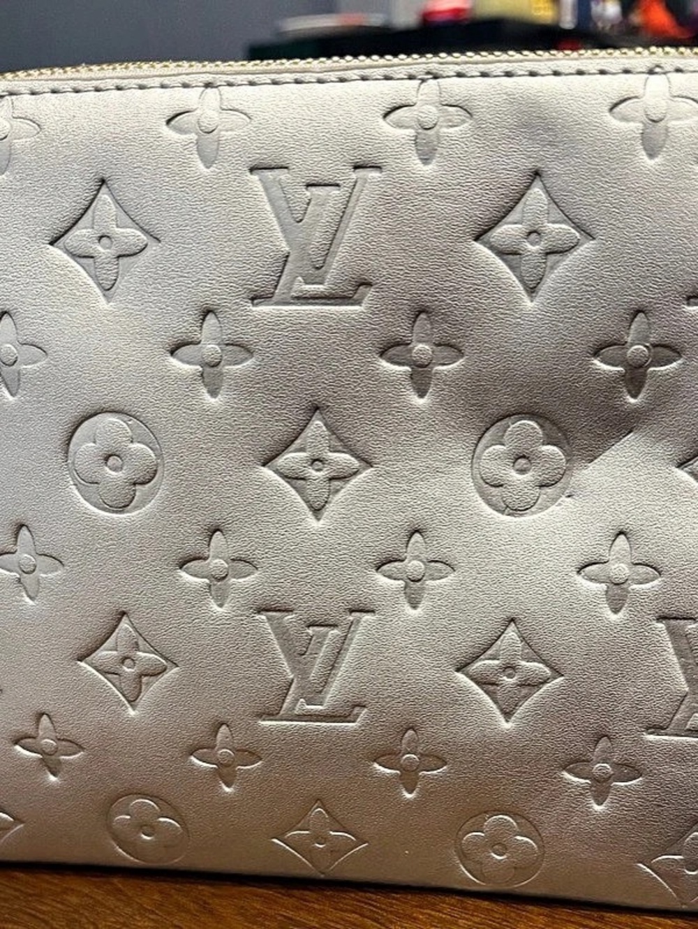 Fashion LV Coussin bag silver with gold chain and silver strap.